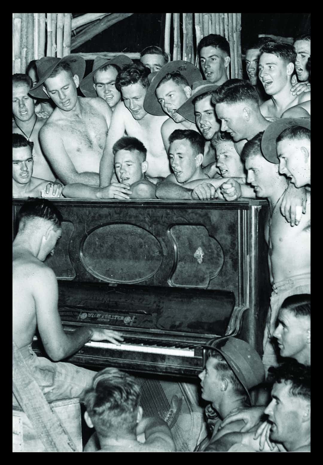 A Community Sing Song Around the Amenities Hut Piano